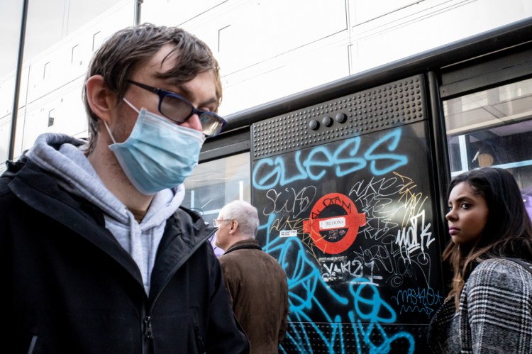 A man in a Covid facemask on Oxford Street in London.