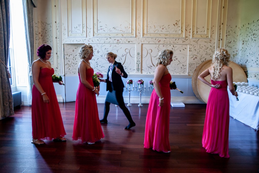 The wedding planner checks out the bridesmaids, before the ceremony at Shropshire wedding venue, Rowton Castle.