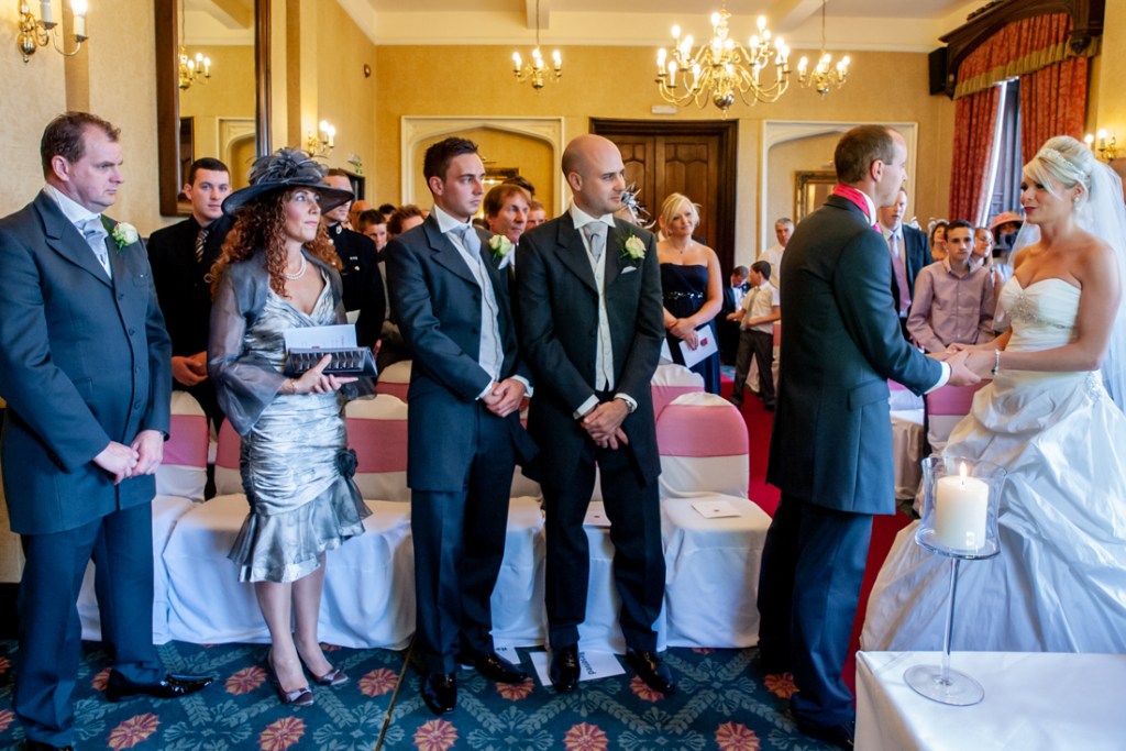 The bride and groom during the ceremony at Shropshire wedding venue, Rowton Castle.