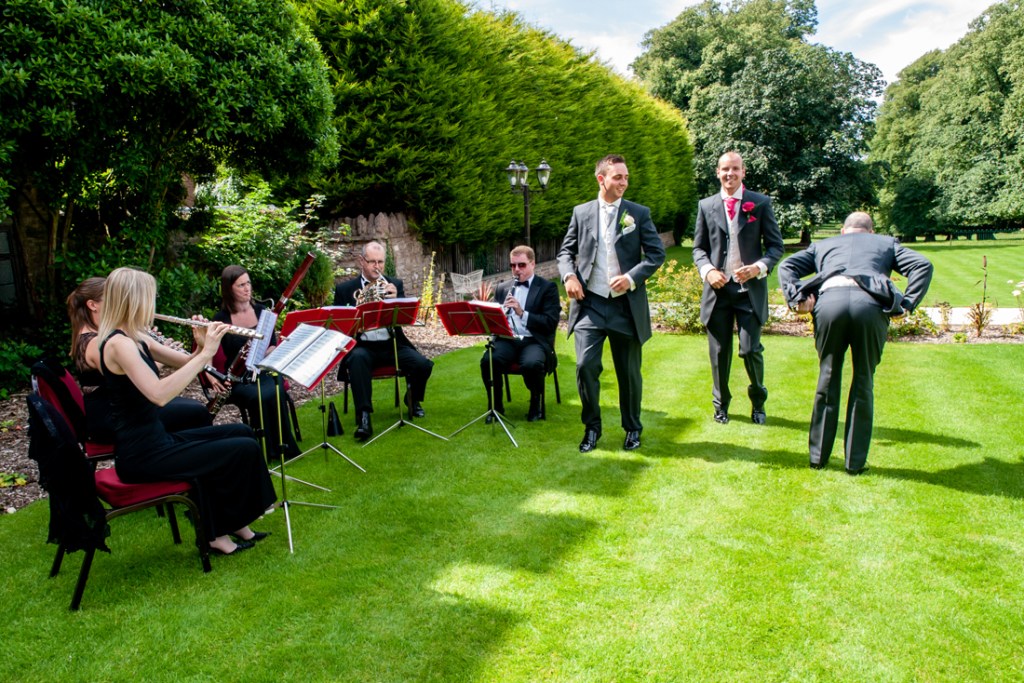 The groomsmen dance to the lawn orchestra at Shropshire wedding venue, Rowton Castle.