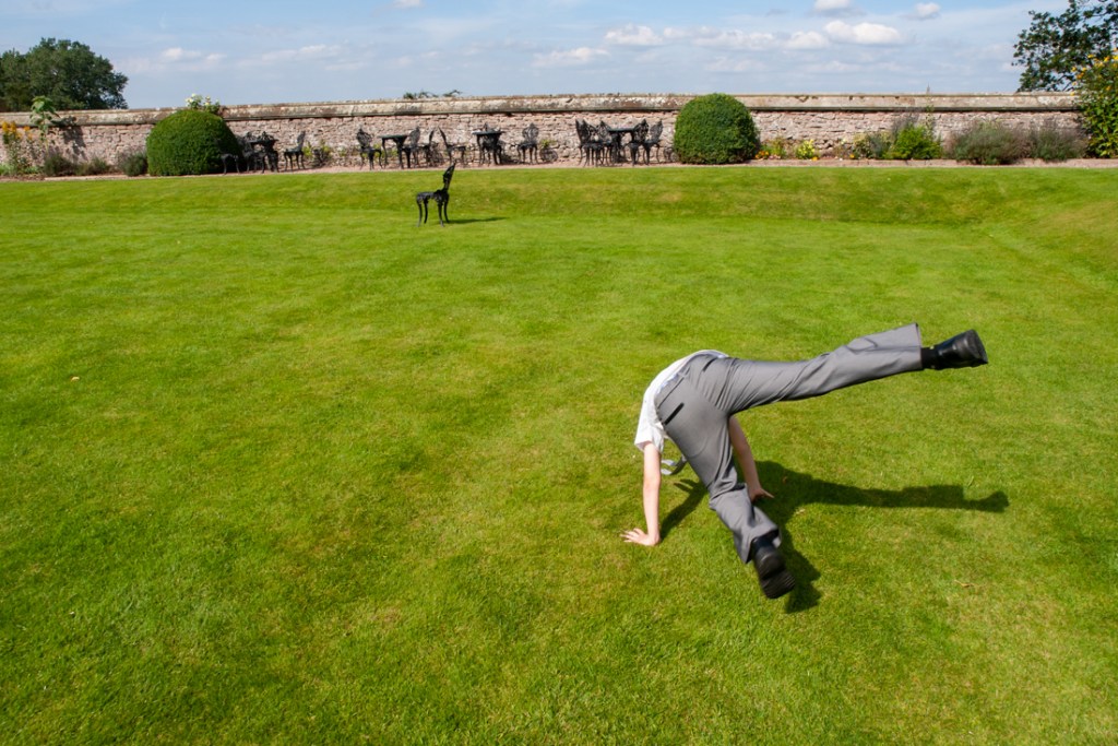 A boy takes a tumble in the grounds of Shropshire wedding venue, Rowton Castle.