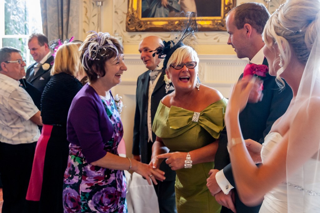 Mother-of-the-Bride laugh during the receiving line at Shropshire wedding venue, Rowton Castle. 
