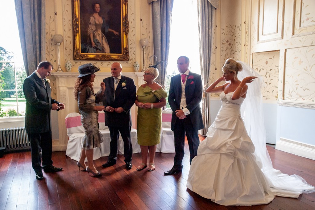 The bridal party chats at Shropshire wedding venue, Rowton Castle.
