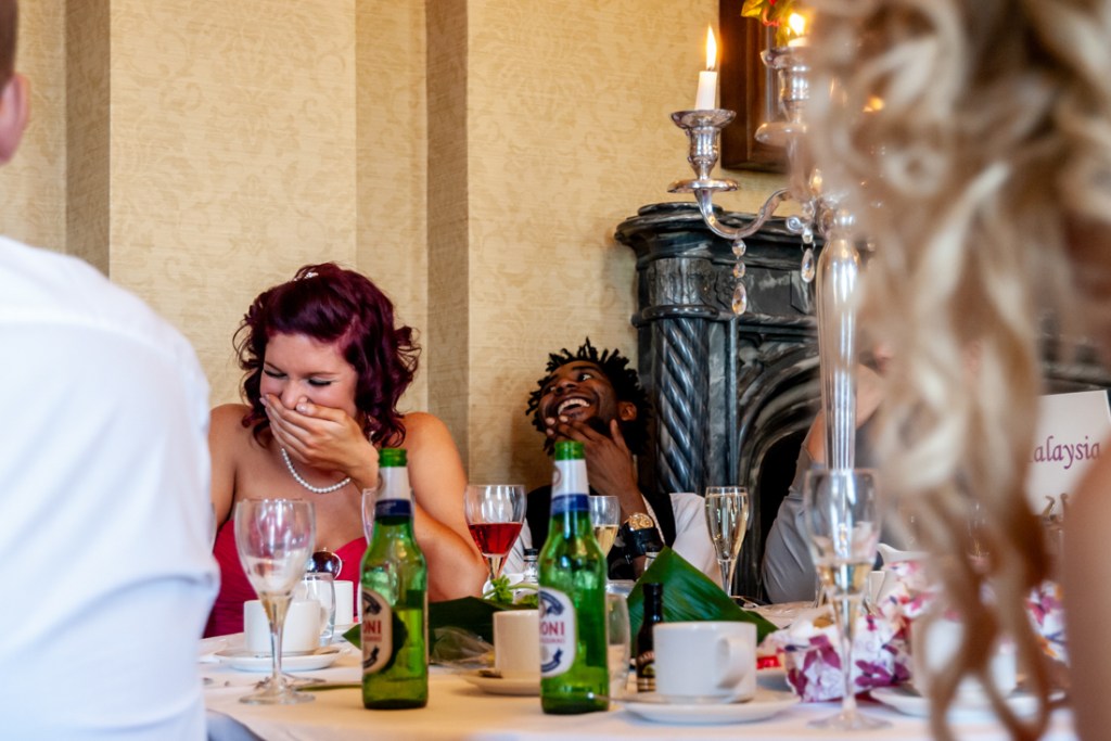 Guest laughing during the speeches at Shropshire wedding venue, Rowton Castle.
