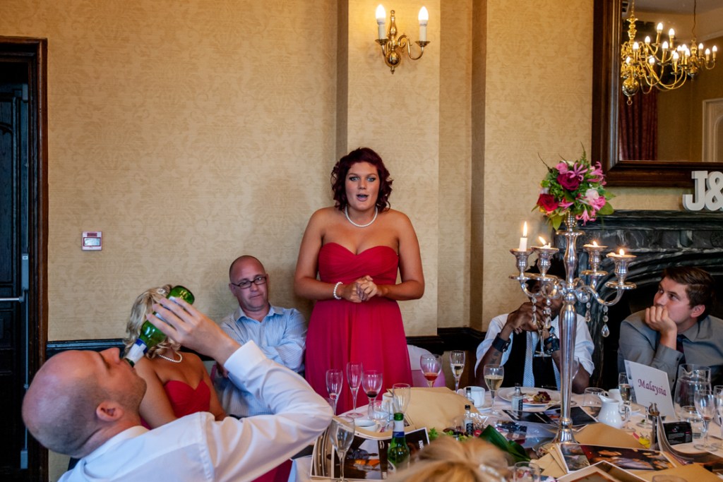 A guest enjoys a beer at Shropshire wedding venue, Rowton Castle.