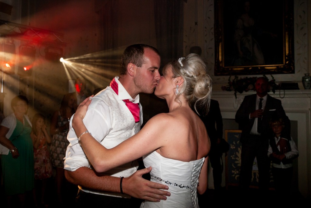 The bride and groom kiss, during their first dance, at Shropshire wedding venue, Rowton Castle.