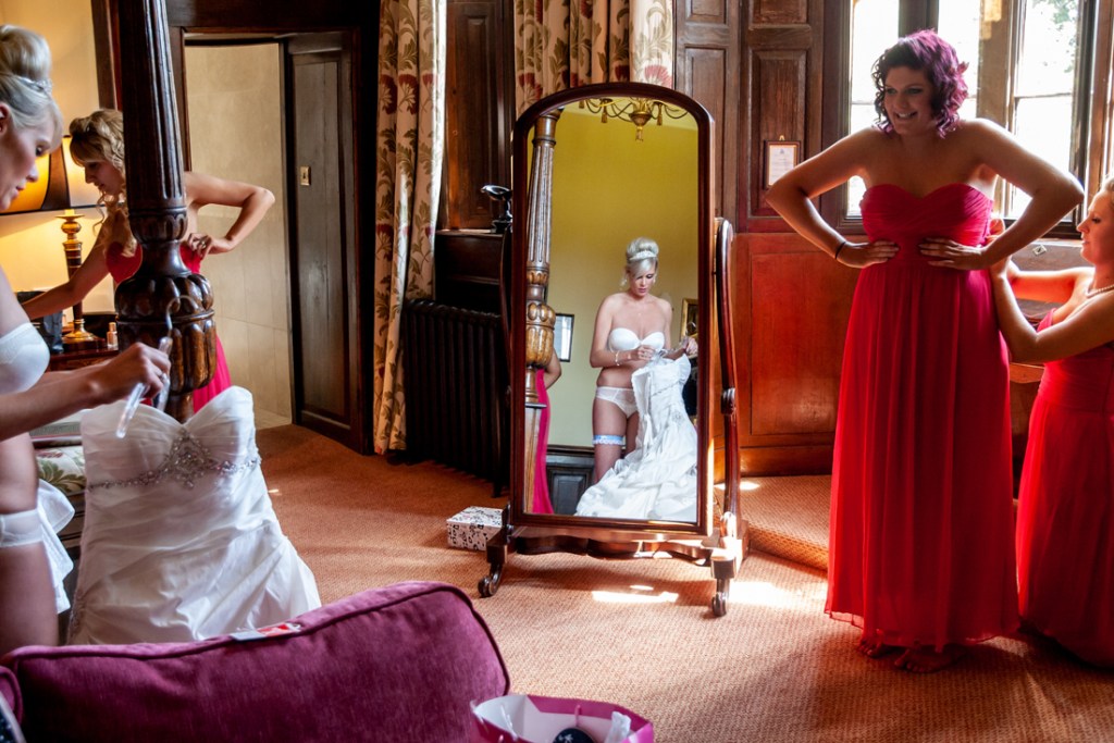 The bride gets dressed at Shropshire wedding venue, Rowton Castle.
