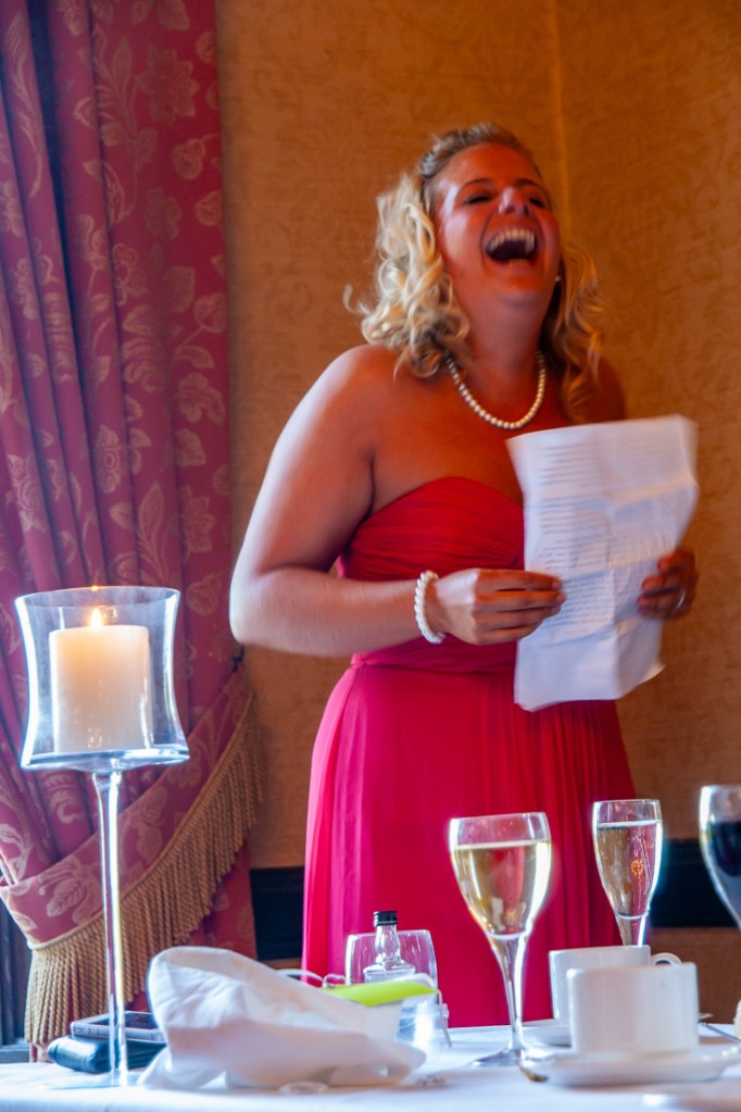 A bridesmaid laughs during her speech, at a wedding at Rowton Castle in Shropshire.