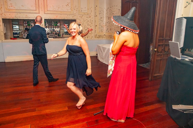 Guests on the dancefloor, one wearing a sombrero,  during a wedding at Rowton Castle in Shropshire.