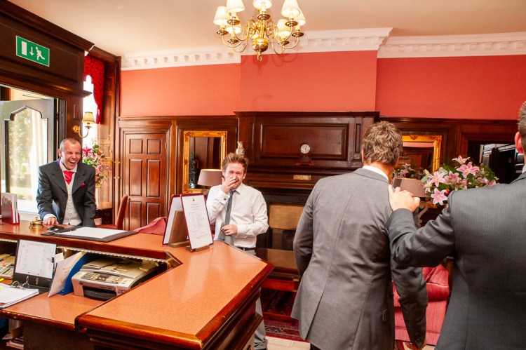 The groomsmen laughing as they arrive for a wedding at Rowton Castle in Shropshire.