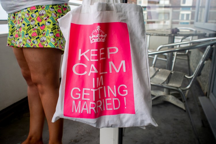A bag that says Keep Calm and Get Married, during the bridal preparations, at a wedding at the Holiday Inn Seafront in Brighton, East Sussex.