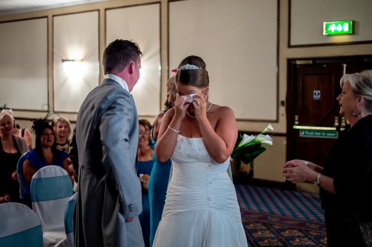 An emotional bride during a wedding ceremony at the Holiday Inn Seafront hotel in Brighton, East Sussex.