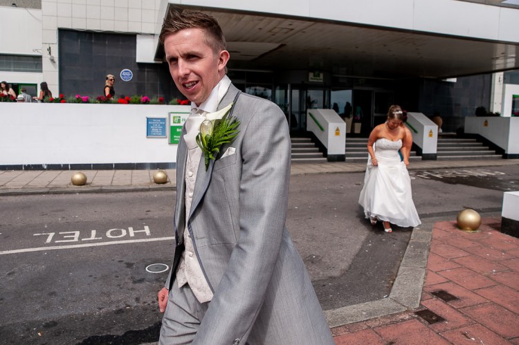 The brie and groom go for a wander outside, during a wedding at the Holiday Inn Seafront hotel in Brighton, East Sussex.