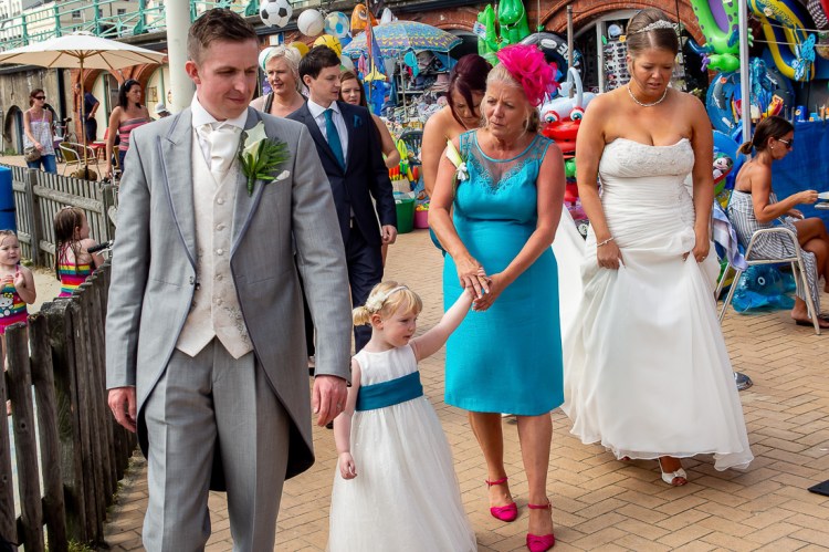 The wedding party on the seafront during a wedding at the Holiday Inn Seafront hotel in Brighton, East Sussex.