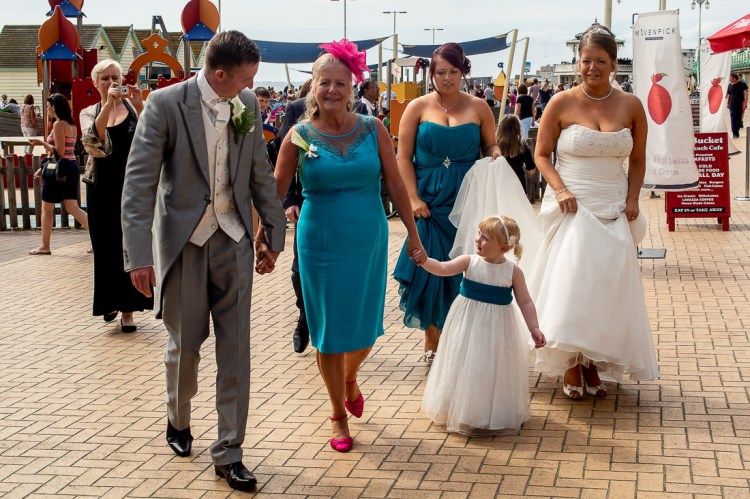 The wedding party on the promenade during a wedding at the Holiday Inn Seafront hotel in Brighton, East Sussex.