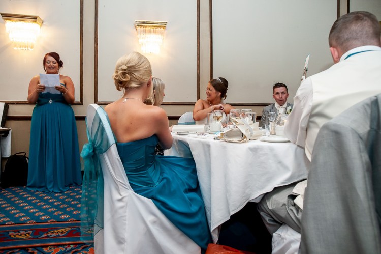 The bride reacts to the bridesmaid during the speeches at a wedding at the Holiday Inn Seafront hotel in Brighton, East Sussex.