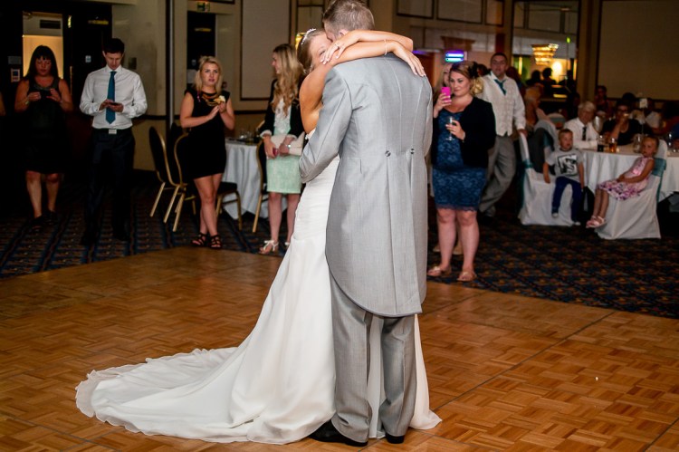 The bride and groom enjoy their first dance, during a wedding at the Holiday Inn Seafront hotel in Brighton, East Sussex.