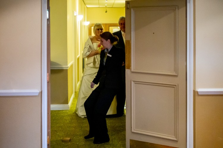 The bride arrives for a wedding ceremony at the Meon Valley Hotel, near Southampton, in Hampshire.