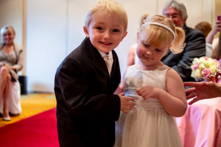 The flower girl and her brother during a wedding at the Meon Valley Hotel, near Southampton, in Hampshire.