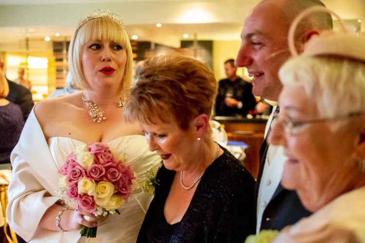The bride with guests during a wedding at the Meon Valley Hotel, near Southampton, in Hampshire.