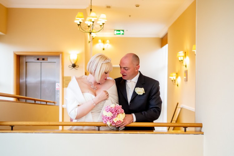 The bride and groom take a quiet moment during a wedding at the Meon Valley Hotel, near Southampton, in Hampshire.