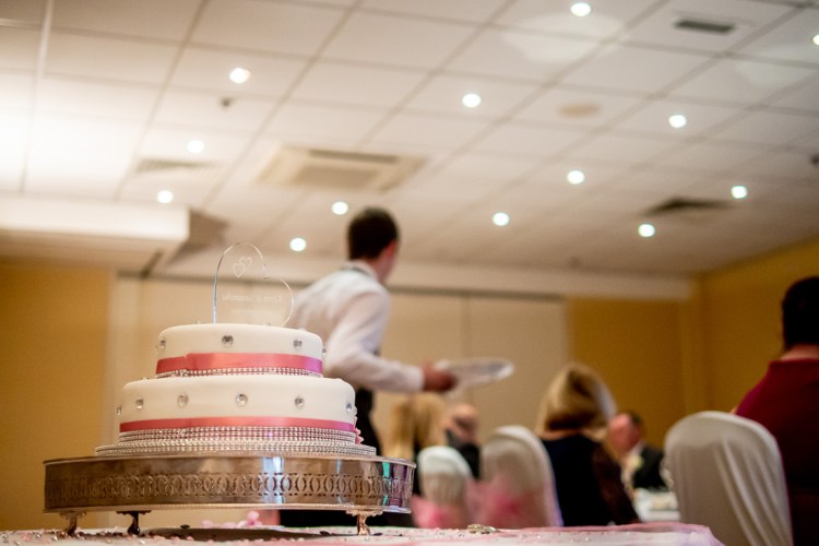 The wedding cake and catering staff during a wedding at the Meon Valley Hotel, near Southampton, in Hampshire.