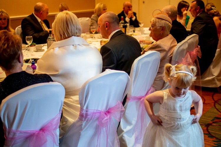 The flower girl during the meal at a wedding at the Meon Valley Hotel, near Southampton, in Hampshire.