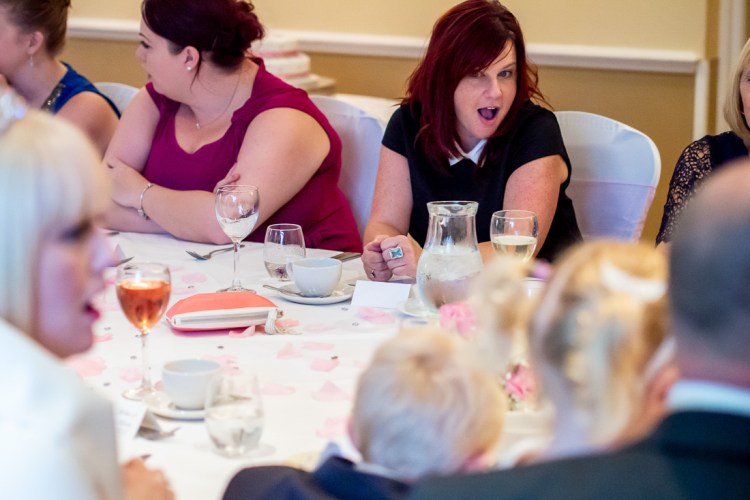 A female guest pulls a funny expression during a wedding at the Meon Valley Hotel, near Southampton, in Hampshire.