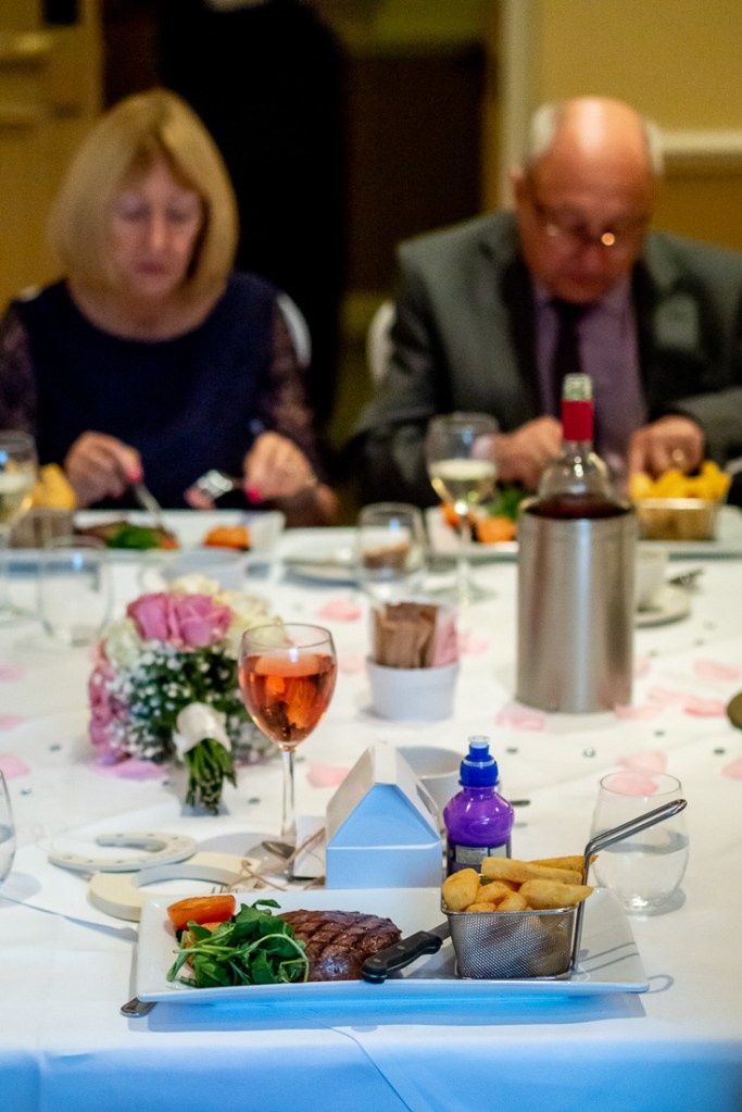 Guests eating during a wedding at the Meon Valley Hotel, near Southampton, in Hampshire.