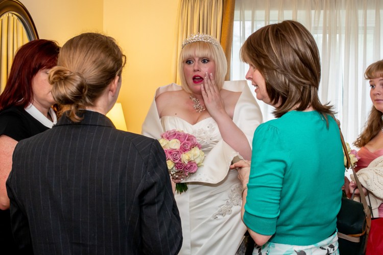 The wedding planner chats to the bride ahead of a wedding at the Meon Valley Hotel, near Southampton, in Hampshire.