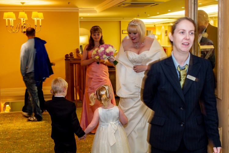 The bride heads to the ceremony at a wedding at the Meon Valley Hotel, near Southampton, in Hampshire.