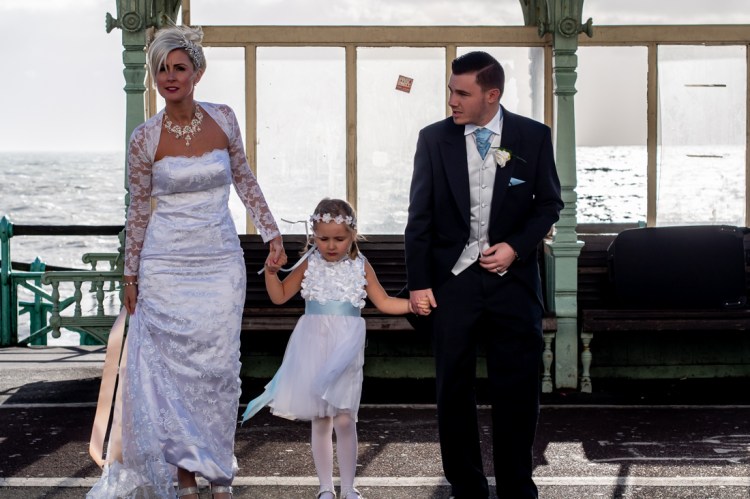The bride and groom out on a wintry seafront, during the wedding ceremonyat the Old Ship Hotel in Brighton, East Sussex.