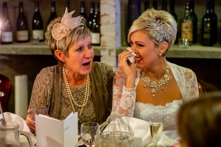 An emotional bride and her mother during the speeches, at the wedding ceremonyat the Old Ship Hotel in Brighton, East Sussex.