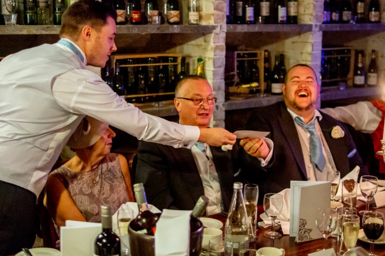 The best man laughs at the groom during the speeches at the wedding ceremonyat the Old Ship Hotel in Brighton, East Sussex.