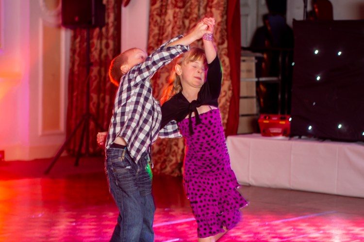 Young guests dancing during a wedding at the Old Ship Hotel in Brighton, East Sussex.