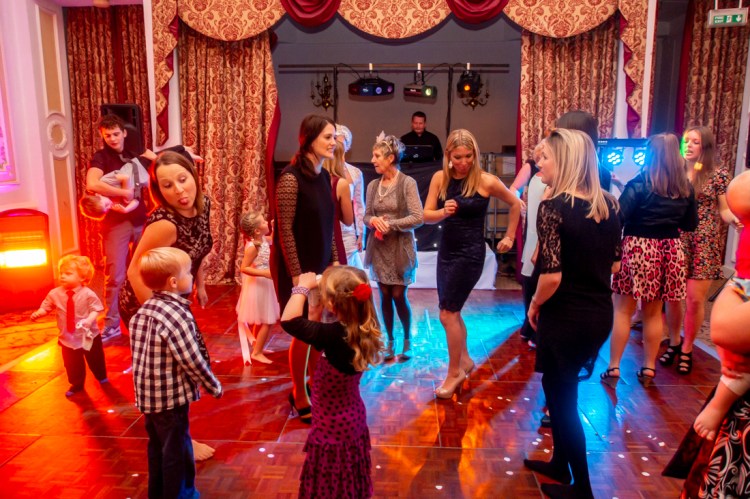 Guests on the dancefloor during the evening wedding reception at the Old Ship Hotel in Brighton, East Sussex.