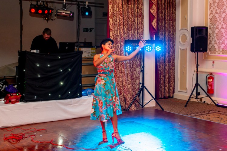 The wedding singer performs duringthe evening wedding reception at the Old Ship Hotel in Brighton, East Sussex.