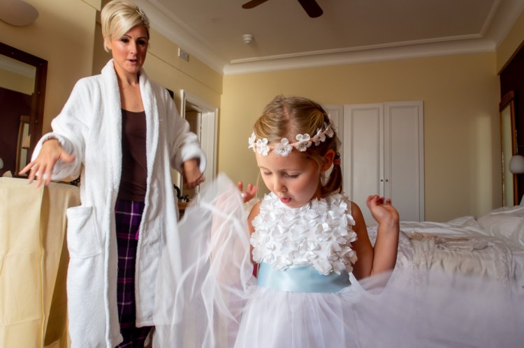 The flower girls shows off her dress, ahead of a wedding at the Old Ship Hotel in Brighton, East Sussex.