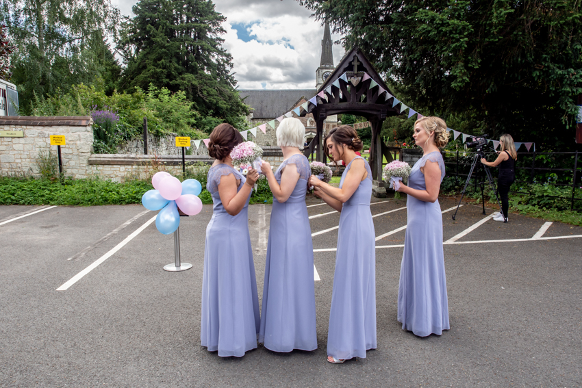 Candid wedding photography of the bridesmaids preparing before a wedding at Gatton Hall in Surrey. Taken by Bristol wedding photographer, Darren Lehane.