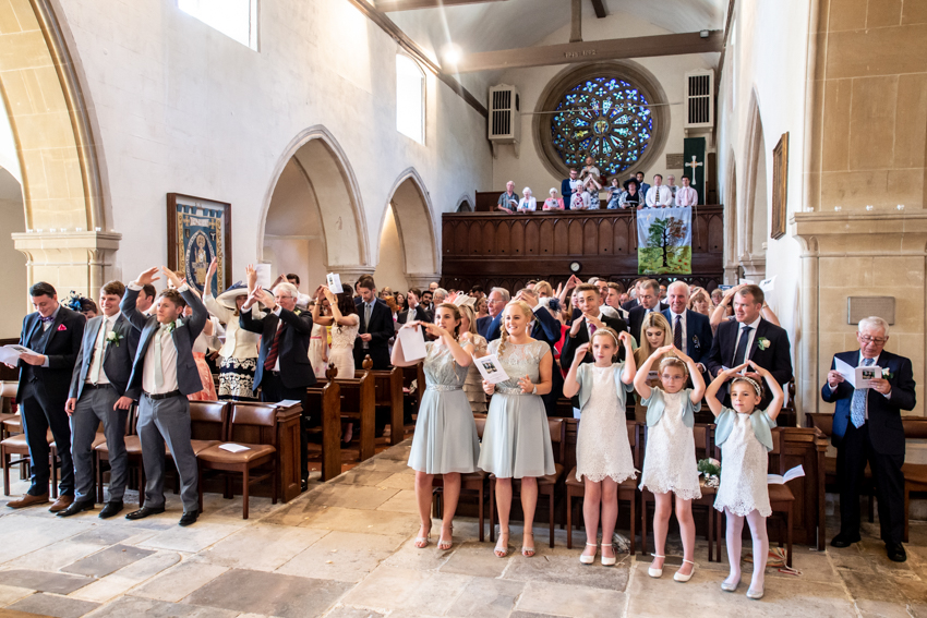 Natural wedding photography of guests dancing during a wedding ceremony on Pagham, Sussex.Taken by Bristol wedding photographer, Darren Lehane.