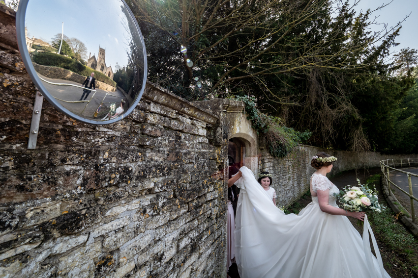 Wedding photojournalism of the bride going to church on the wedding day at Grittleton House in Wiltshire. Taken by Bristol wedding photographer, Darren Lehane.