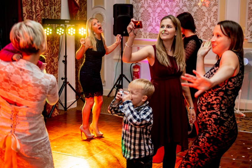 Documentary wedding photography of guests dancing during a wedding at the Old Ship Hotel in Brighton, East Sussex. Taken by Bristol wedding photographer, Darren Lehane.