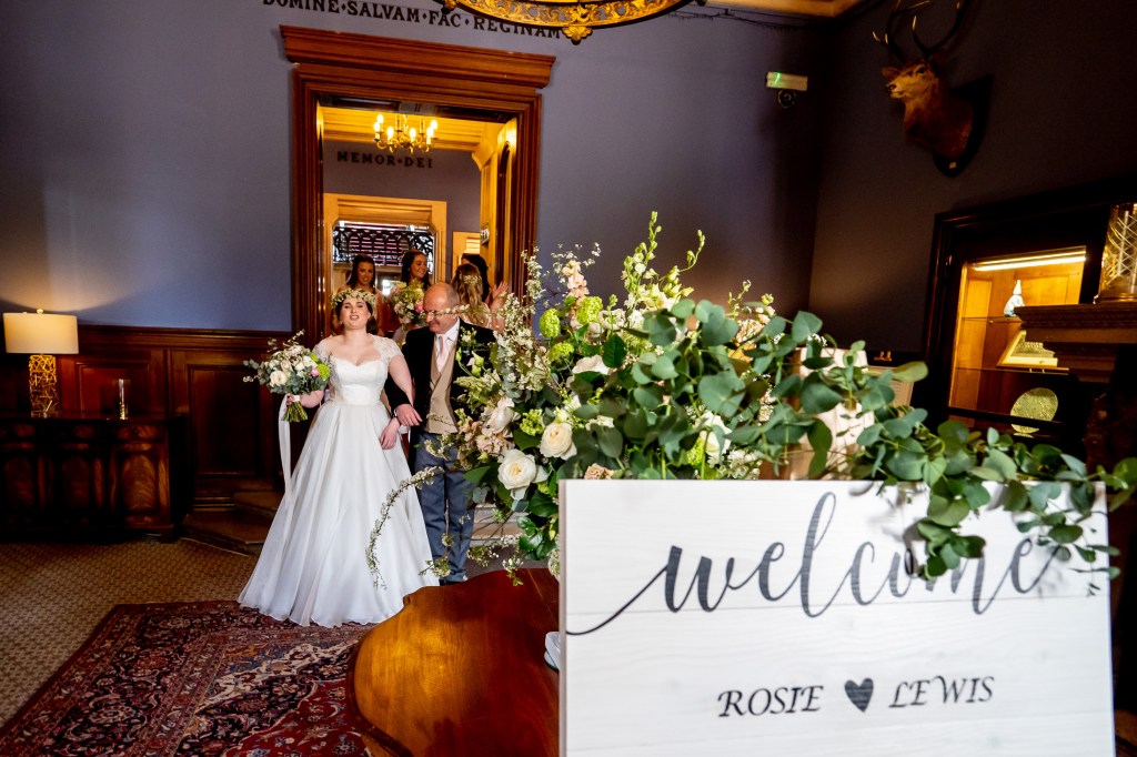 The bride and her father before the wedding ceremony at Grittleton House in Wiltshire.