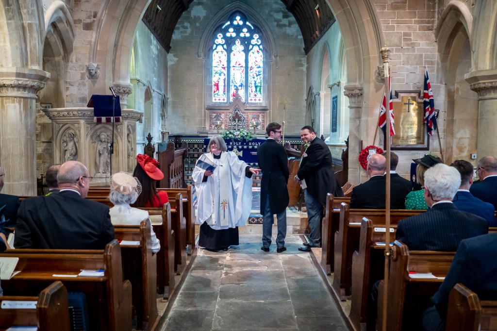 The groom waits nervously for the bride during the wedding ceremony at Grittleton House in Wiltshire.