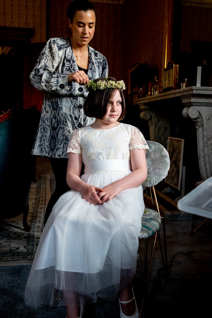 The flower girl has her hair done ahead of the wedding at Grittleton House in Wiltshire.
