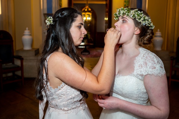 The bride has her makeup touched up, during a wedding at Grittleton House in Wiltshire.
