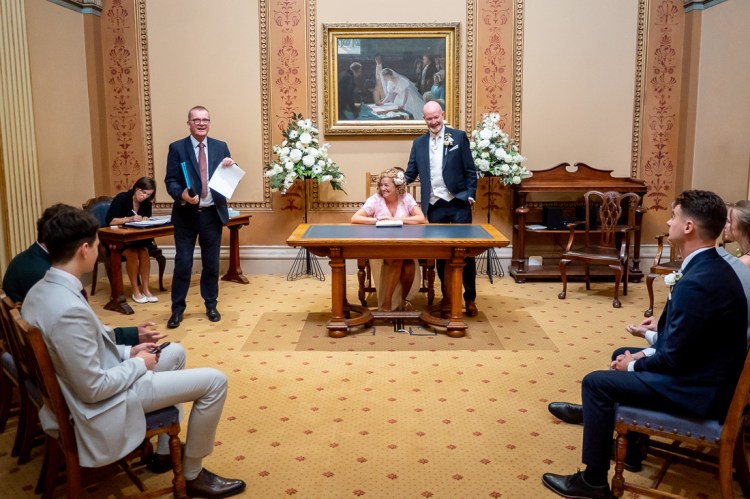 The registrar with the wedding certificate during a wedding at Bristol Register Office in Bristol.