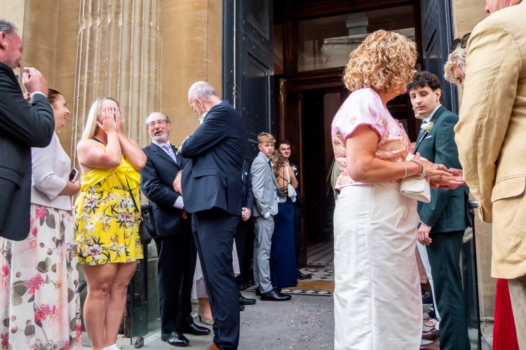 The bride and groom chat with guests, after a wedding at Bristol Register Office in Bristol.