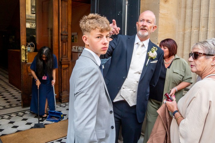 The groom points out something, after a wedding at Bristol Register Office in Bristol.