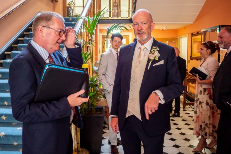 The groom chats with guests ahead of a wedding at Bristol Register Office in Bristol.